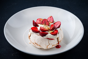 sweet dessert meringue with fresh strawberries