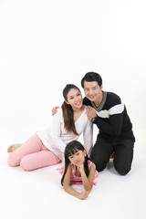 South East Asian father mother daughter parent child happy look at camera on floor white background