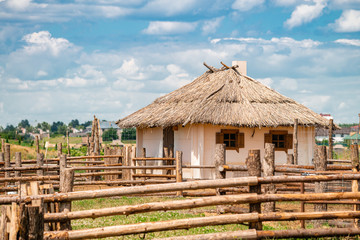 Fototapeta na wymiar national traditional house of Slavs with a roof made of reeds or straw