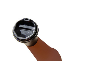 Black cup of coffee isolated on white background top view