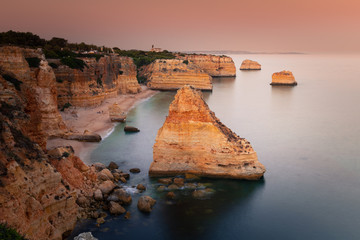 Fototapeta na wymiar Praia da Marinha cove with the impressive cliffs at Algarve, Portugal.