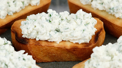bruschetta with ricotta cheese and herbs close up. Healthy appetizer © Евгений Логвиненко