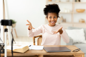 African Teen Girl Making Video For Blog Sitting At Home