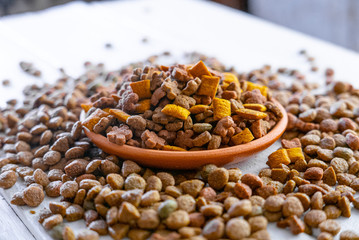 Clay bowl with a dry pet food