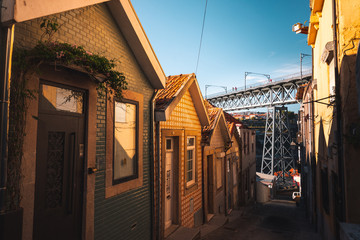 Little houses and Luis II bridge  at Porto city centre, Portugal.