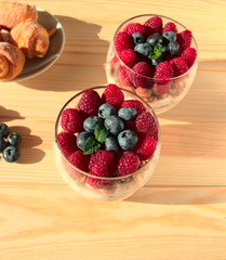 Berries in a glass close-up. Beautiful photo of food on the screensaver. Layered dessert in a glass.