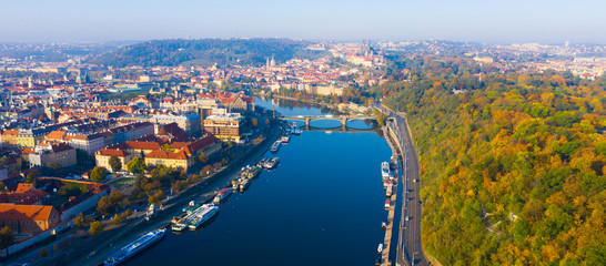 Fototapeta premium Picturesque view from drone of Prague on banks on Vltava river, capital and largest city of Czech Republic on fall day