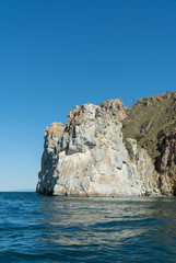 Cape Sagan-Khushun, rocky coast. called as the Cape Three brothers. Three stone peaks symbolizing the three brothers.