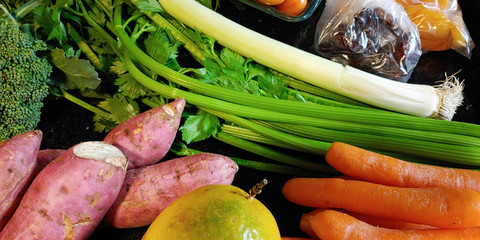 A small variety of fruits and vegetables that have just arrived from the organic fair.