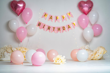 Happy Birthday! decoration with glowing lights, birthday garland, balloons