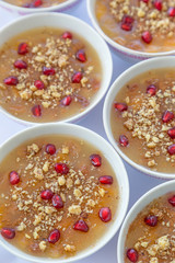Turkish dessert Ashura, Noah's pudding, with pomegranate seeds and walnut