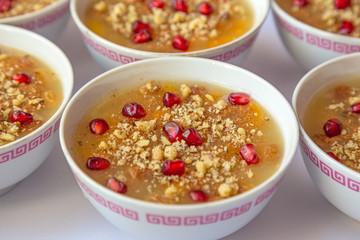 Turkish dessert Ashura, Noah's pudding, with pomegranate seeds and walnut
