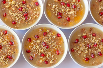 Turkish dessert Ashura, Noah's pudding, with pomegranate seeds and walnut