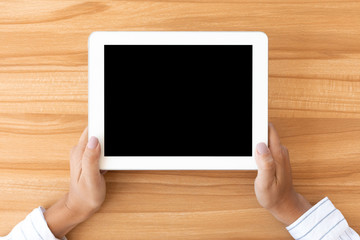 Shot of woman using her digital tablet with blank screen