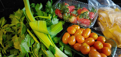 A small variety of fruits and vegetables that have just arrived from the organic fair.