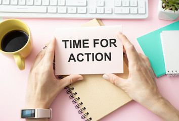 business woman holding a notebook with the text Time for action