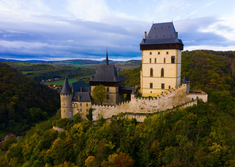 Fototapeta na wymiar Aerial view of medieval Karlstejn castle in autumn park, Czech Republic