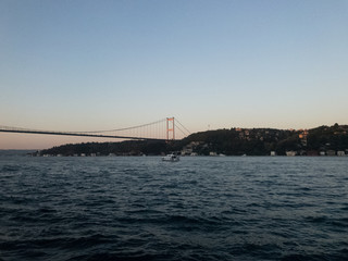 Landscape of Turkey's Bosporus Bridge from the Bosporus strain at sunset