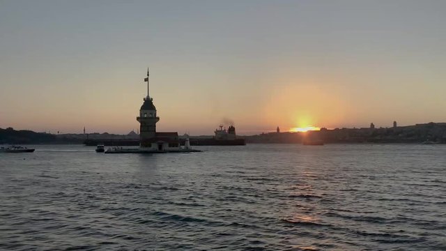 Time-lapse of Istanbul Maiden Tower  Tower of Leandros, Turkish: Kiz Kulesi at sunset on the entrance to Bosporus Strait in Istanbul, Turkey.