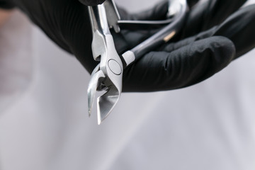 hold manicure tool, nippers close up