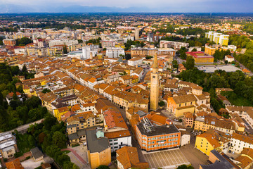 Scenic cityscape from drone of Italian town of Pordenone in sunny day, Italy