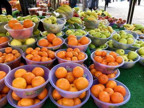 Oranges and apples on display at a farmers market - UK