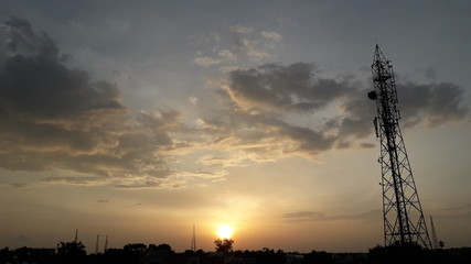 cellular tower with sunrise 