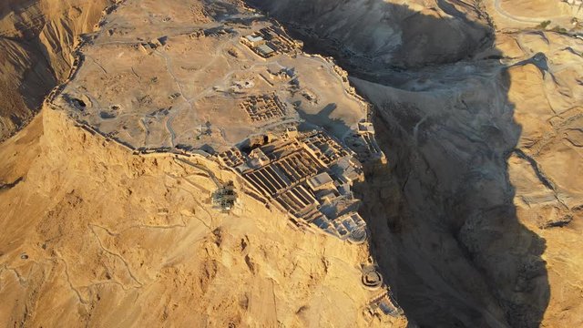 Aerial view of the ruins of Massada is a fortress built by Herod the Great on a cliff-top off the coast of the Dead Sea. Destroyed by the Romans in the 1st century AD e. In UNESCO World Heritage List