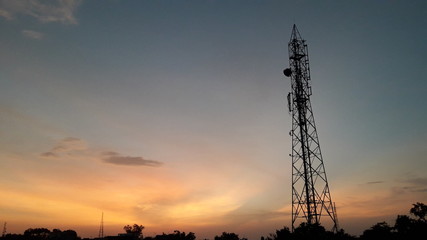 sunrise moments with colourful sky and cellular tower 