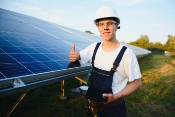 Renewable energy and solar power concept, worker or Electrical engineers are checking and training installing photovoltaic plant in solar power station alternative energy from nature