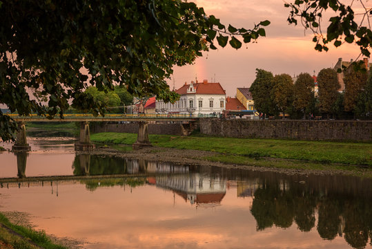 Amazing city view of Uzhhorod at sunset, scenic summer cityscape of old european town on the river Uzh, Zakarpattia, Ukraine, Eastern Europe