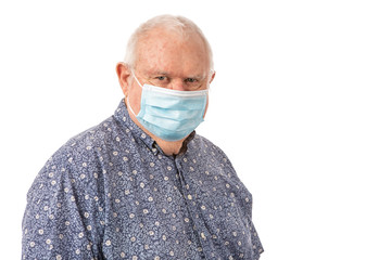 Senior man wearing a protective mask and looking at the camera on a white background.