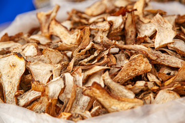 Lots of dried mushrooms in a bag at a rural fair