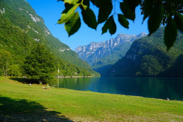 The Lago del Mis is lake in Belluno, Veneto, Italy,  looks very beautiful with its green colors. It's morning and sunrise. Beautiful Italian nature.  © Travel Photos