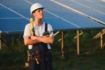 Renewable energy and solar power concept, worker or Electrical engineers are checking and training installing photovoltaic plant in solar power station alternative energy from nature