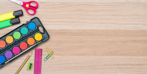 School supplies on a wooden background with copy space