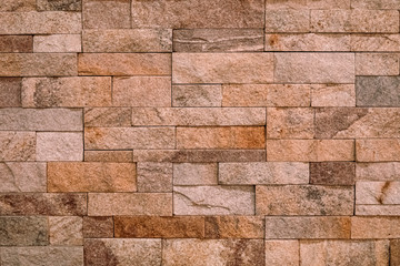Obraz premium Warm brown sand stone tiles texture for texture background and copy space.