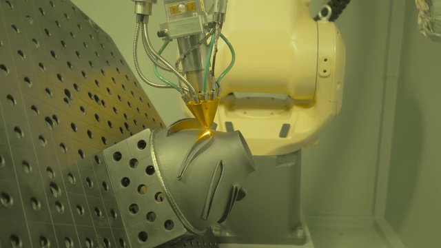 Metalworking, robotic, industrial concept. Direct metal deposition - advanced additive laser melting and powder spray manufacturing technology for repair, rebuild metal workpieces