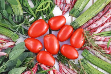 geometric composition of fruits and vegetables on white table top view