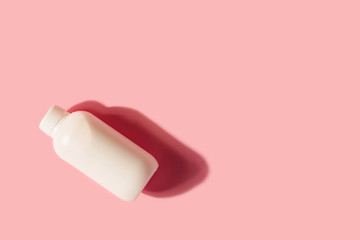 Empty mockup white plastic bottle with shadows.