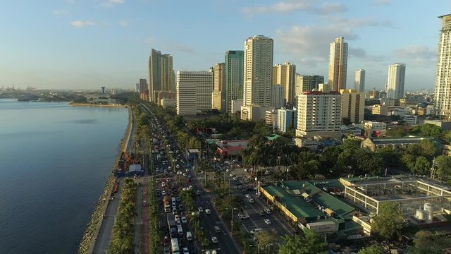 Breathtaking Aerial Shot Of Manila Bay Buildings And Roxas Boulevard During Sunset