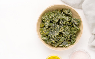Kale chips on a white background. Copy space