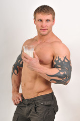 Bodybuilder with milk