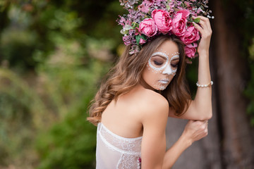 Closeup portrait of Calavera Catrina in pink dress. Sugar skull makeup. Dia de los muertos. Day of The Dead. Halloween