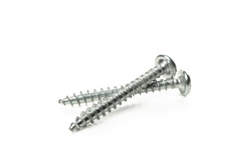 Two metal screws isolated on white background