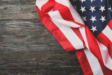 American flag on wooden background, space for text