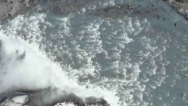 Drone top-down view of Dettifoss Waterfall, Iceland - Downstream tracking shot