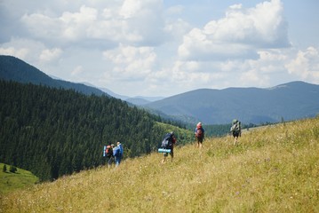 Fototapeta na wymiar Hiking team in the mountains. travel sport lifestyle concept