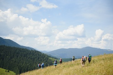 Fototapeta na wymiar Group of hikers walking on mountain