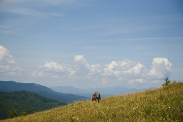 Fototapeta na wymiar Group of hikers walking on mountain